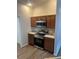 Kitchen featuring wooden cabinetry, a stainless steel oven, microwave, and solid surface countertops at 627 Vagabond St, The Villages, FL 32163