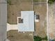Aerial view of the home showcasing the roof, landscaping, and surrounding neighborhood, offering a bird's eye perspective at 6671 Se 108Th St, Belleview, FL 34420