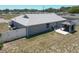 Beautiful backyard with a covered patio and well-maintained lawn, perfect for outdoor entertaining and relaxation at 6671 Se 108Th St, Belleview, FL 34420