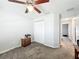Bedroom featuring neutral walls, carpeted floors, closet and dresser, creating a cozy space at 6671 Se 108Th St, Belleview, FL 34420
