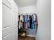 Walk-in closet featuring wire shelving offering ample storage for clothing and accessories at 6671 Se 108Th St, Belleview, FL 34420