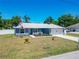 Attractive single-story home with lush landscaping and an attached garage, offering comfort and style at 6671 Se 108Th St, Belleview, FL 34420