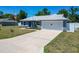 A lovely home boasting an attached garage and a spacious driveway, ideal for parking multiple vehicles at 6671 Se 108Th St, Belleview, FL 34420