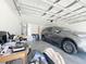 Spacious two-car garage with high ceilings and ample storage space for vehicles and belongings at 6671 Se 108Th St, Belleview, FL 34420