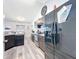 This modern kitchen features stainless steel appliances, dark cabinetry and a granite countertops at 6671 Se 108Th St, Belleview, FL 34420