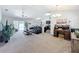 Open concept living room with natural light, modern decor, and an inviting layout for comfortable living at 6671 Se 108Th St, Belleview, FL 34420