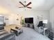 This living room features a ceiling fan, neutral walls and a comfortable sitting area at 6671 Se 108Th St, Belleview, FL 34420