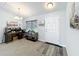 This office features a front door, desk area and neutral colored walls at 6671 Se 108Th St, Belleview, FL 34420