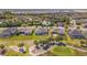Aerial view of the community showcasing golf course frontage, manicured lawns, and spacious homes at 7503 Sw 97Th Terrace Rd, Ocala, FL 34481