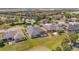 An aerial view of several single-Gathering homes with screened-in patios in a neatly planned residential neighborhood at 7503 Sw 97Th Terrace Rd, Ocala, FL 34481