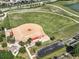 Aerial view of the baseball field with parking and a park-like setting, great for community sports at 7503 Sw 97Th Terrace Rd, Ocala, FL 34481