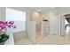 Bright bathroom features a glass enclosed shower with stylish tilework, towel racks, and a neutral color scheme at 7503 Sw 97Th Terrace Rd, Ocala, FL 34481