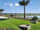 Lush community lawn with cornhole boards for outdoor fun and relaxation at 7503 Sw 97Th Terrace Rd, Ocala, FL 34481