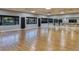 Bright dance studio with hardwood floors, mirrors, and barre, perfect for fitness and dance classes at 7503 Sw 97Th Terrace Rd, Ocala, FL 34481