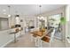 The dining area has a table with 4 chairs and bar seating with a view to the back patio at 7503 Sw 97Th Terrace Rd, Ocala, FL 34481