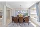 Bright dining room with modern chandelier and stylish area rug at 7503 Sw 97Th Terrace Rd, Ocala, FL 34481