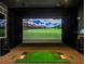 State-of-the-art golf simulator room offers a realistic golfing experience for residents at 7503 Sw 97Th Terrace Rd, Ocala, FL 34481