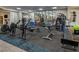 Well-equipped gym includes rowing machines and weightlifting equipment for a comprehensive workout at 7503 Sw 97Th Terrace Rd, Ocala, FL 34481