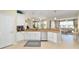 Spacious kitchen with granite counters, stainless steel appliances, and view to the backyard at 7503 Sw 97Th Terrace Rd, Ocala, FL 34481
