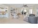 A living space with a bar area and seating is well lit with many places to sit and relax at 7503 Sw 97Th Terrace Rd, Ocala, FL 34481