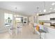 The open floor plan has a dining area, bar seating, and an updated kitchen at 7503 Sw 97Th Terrace Rd, Ocala, FL 34481