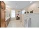 Spacious main bathroom featuring a dual vanity, tiled shower, and a separate seating area at 7503 Sw 97Th Terrace Rd, Ocala, FL 34481