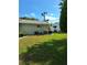 Well-maintained backyard with lush green lawn, complemented by tidy shrubbery at 8107 Sw 108Th Place Rd, Ocala, FL 34481
