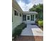 Backyard featuring a patio, a small sunroom, and partial shade at 8107 Sw 108Th Place Rd, Ocala, FL 34481
