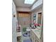 Well-lit bathroom featuring a shower-tub combo and a bright skylight above at 8107 Sw 108Th Place Rd, Ocala, FL 34481