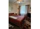 Comfortable bedroom featuring soft lighting, calming colors, and spacious closets at 8107 Sw 108Th Place Rd, Ocala, FL 34481