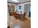Traditional dining room featuring wood flooring, a china cabinet, and a glass sliding door at 8107 Sw 108Th Place Rd, Ocala, FL 34481