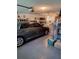 Spacious garage with a car, storage shelves, and abundant additional space at 8107 Sw 108Th Place Rd, Ocala, FL 34481