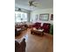 Comfortable living room featuring wood floors, bright window, and plenty of space for relaxation at 8107 Sw 108Th Place Rd, Ocala, FL 34481
