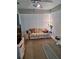 Cozy living room featuring a comfortable sofa, ceiling fan and window blinds at 8107 Sw 108Th Place Rd, Ocala, FL 34481