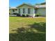 Enclosed sunroom with multiple windows offering natural light and backyard view at 8107 Sw 108Th Place Rd, Ocala, FL 34481