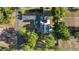 Aerial view of home with a pool, large backyard, mature trees, and a long driveway at 8215 Sw 53Rd Ct, Ocala, FL 34476