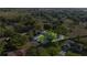 Aerial view of the property showcasing the home's location within a mature wooded neighborhood at 8215 Sw 53Rd Ct, Ocala, FL 34476