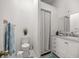 Bright bathroom featuring a shower, modern white vanity, and neutral decor at 8215 Sw 53Rd Ct, Ocala, FL 34476