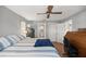 Spacious bedroom featuring hardwood floors and view into an en suite bathroom at 8215 Sw 53Rd Ct, Ocala, FL 34476