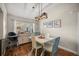 Charming dining area with modern lighting and decorative wall art at 8215 Sw 53Rd Ct, Ocala, FL 34476