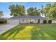 Charming single-story home with a well-manicured lawn and mature trees, offering great curb appeal at 8215 Sw 53Rd Ct, Ocala, FL 34476