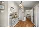 Hallway with stylish storage and a view into the laundry room at 8215 Sw 53Rd Ct, Ocala, FL 34476