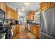 Bright kitchen featuring stainless steel refrigerator and ample wooden cabinetry at 8215 Sw 53Rd Ct, Ocala, FL 34476