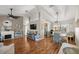 Open-concept living area with fireplace, dining area and modern furnishings at 8215 Sw 53Rd Ct, Ocala, FL 34476