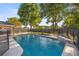 Sparkling pool featuring a waterfall feature and a secure safety fence at 8215 Sw 53Rd Ct, Ocala, FL 34476