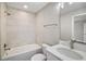 Bright bathroom featuring a shower over tub, white marble vanity, and modern fixtures at 8725 Sw 136Th Ter, Dunnellon, FL 34432