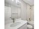 Contemporary bathroom with a shower over tub, brushed nickel fixtures, and white marble vanity at 8725 Sw 136Th Ter, Dunnellon, FL 34432