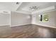 Well-lit living room featuring hardwood floors, recessed lighting, and a view of the outside at 8725 Sw 136Th Ter, Dunnellon, FL 34432