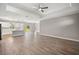 Spacious open-concept living area with hardwood floors and a bright, modern kitchen with an island at 8725 Sw 136Th Ter, Dunnellon, FL 34432