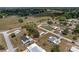 Aerial view showcases the home's location within a tranquil community surrounded by mature trees and open spaces at 10040 Sw 93Rd Ct, Ocala, FL 34481